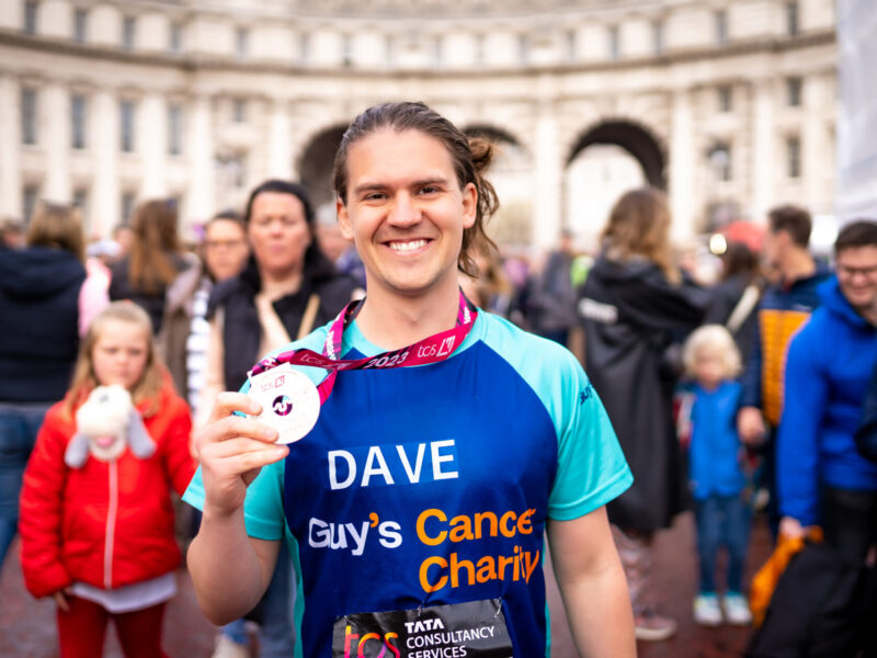 Runner for Guy's Cancer Charity with medal