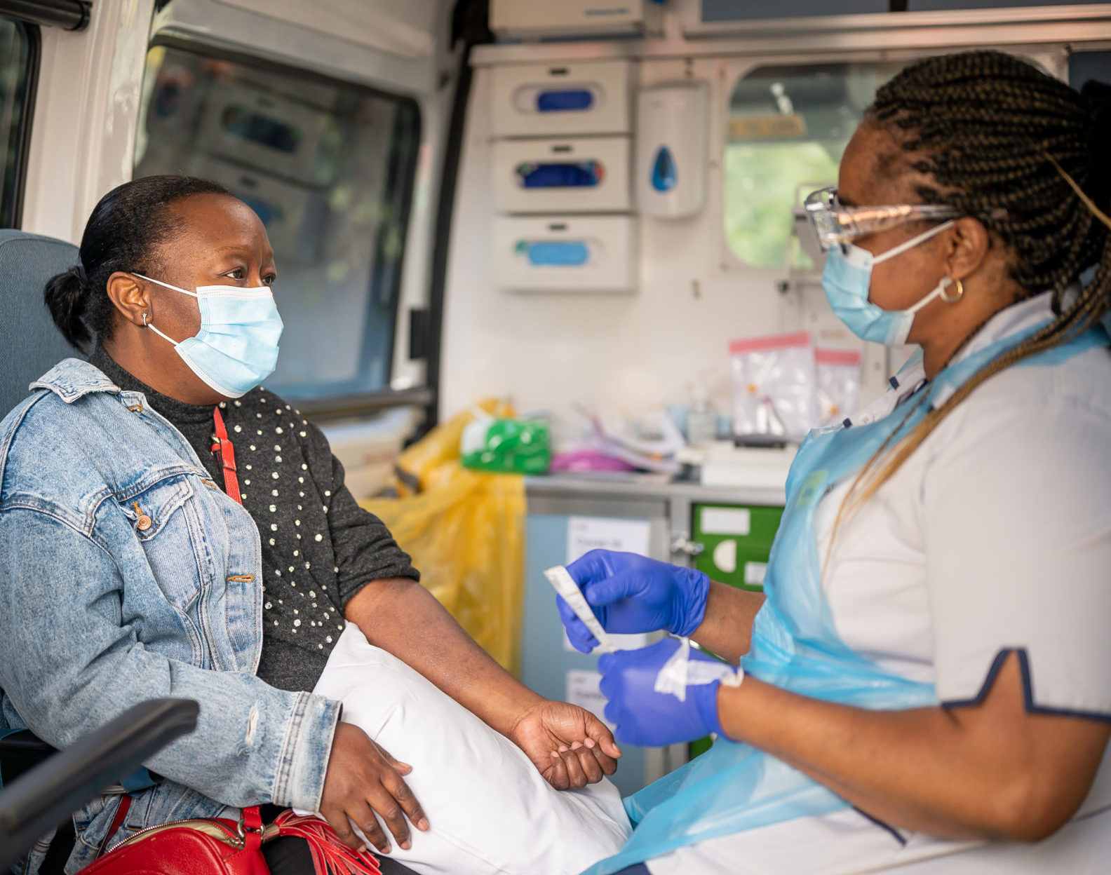 Nurse Jade with patient Patricia, inside the ambulance about to begin tests