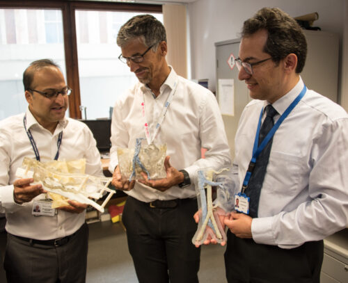 Surgeons with 3D printed models