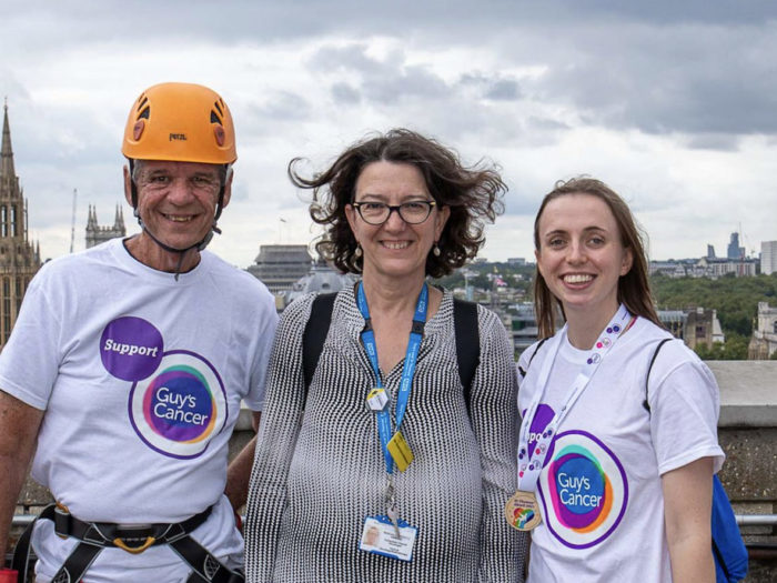 Three staff on roof about to abseil
