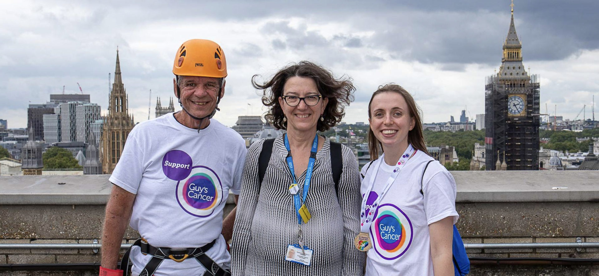 Three staff on roof about to abseil