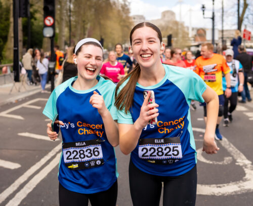Image of two girls smiling running the London Landmarks Half Marathon