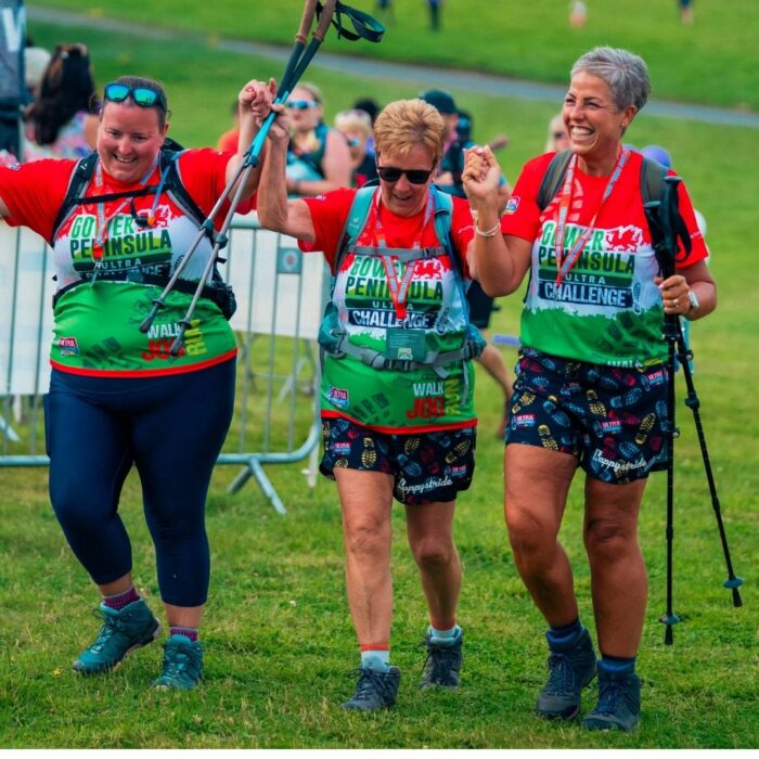 Three Ultra Challengers taking part in the event, they appear to be happy with walking sticks in their hands.