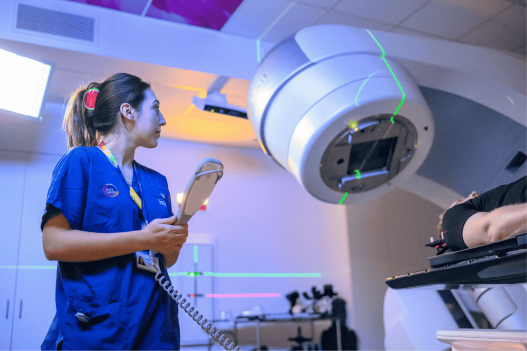 Nurse using the HyperArc machine on patient