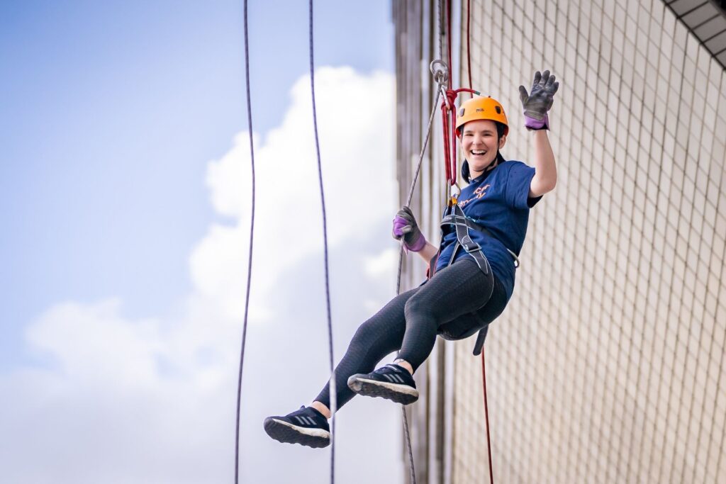 Woman abseiling down St Thomas