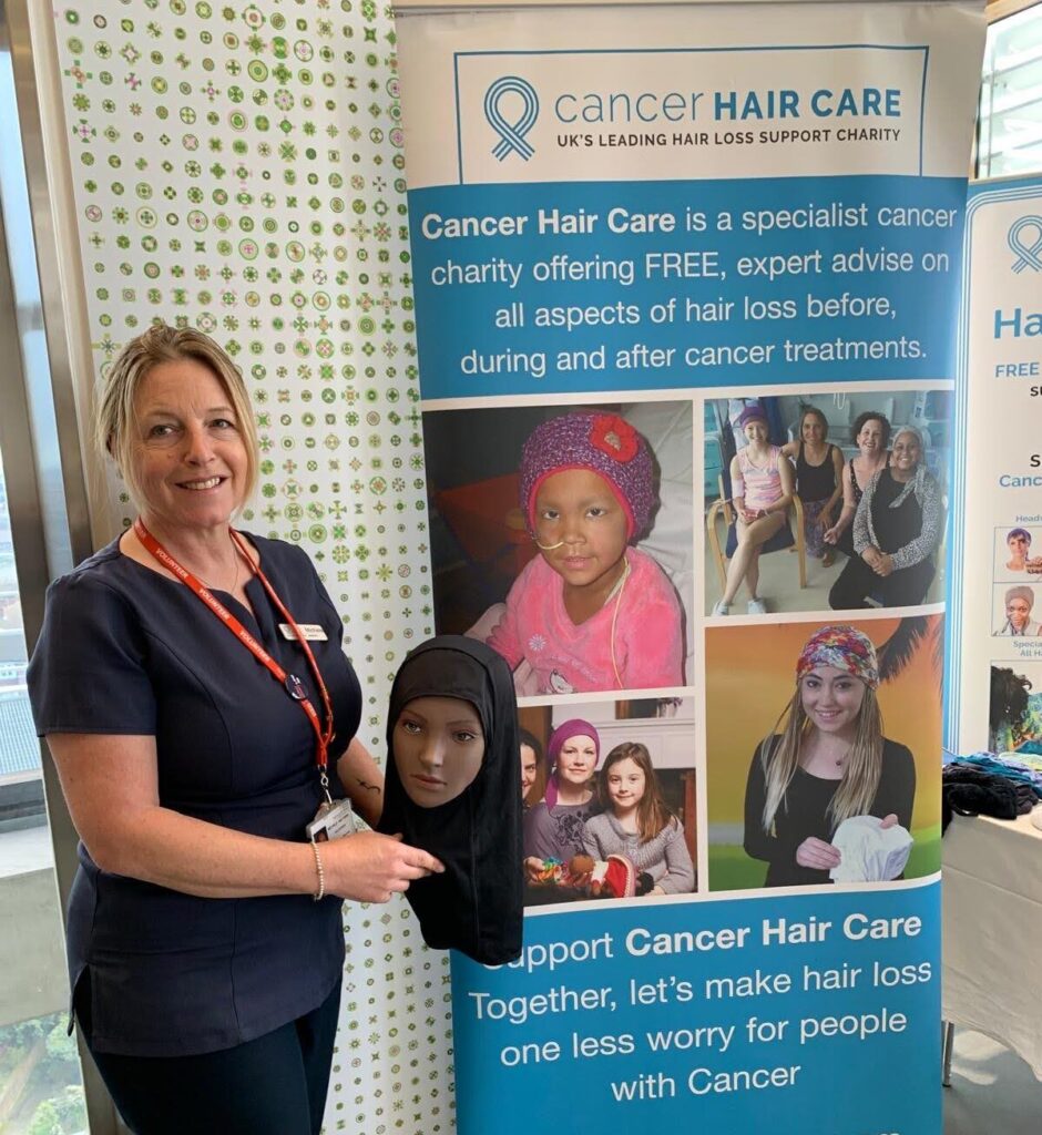 Woman holding a mannequin head that