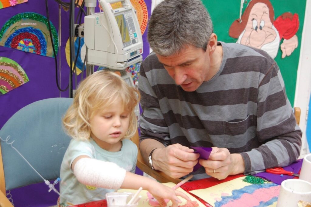 Lizzie with her dad at the hospital whilst she